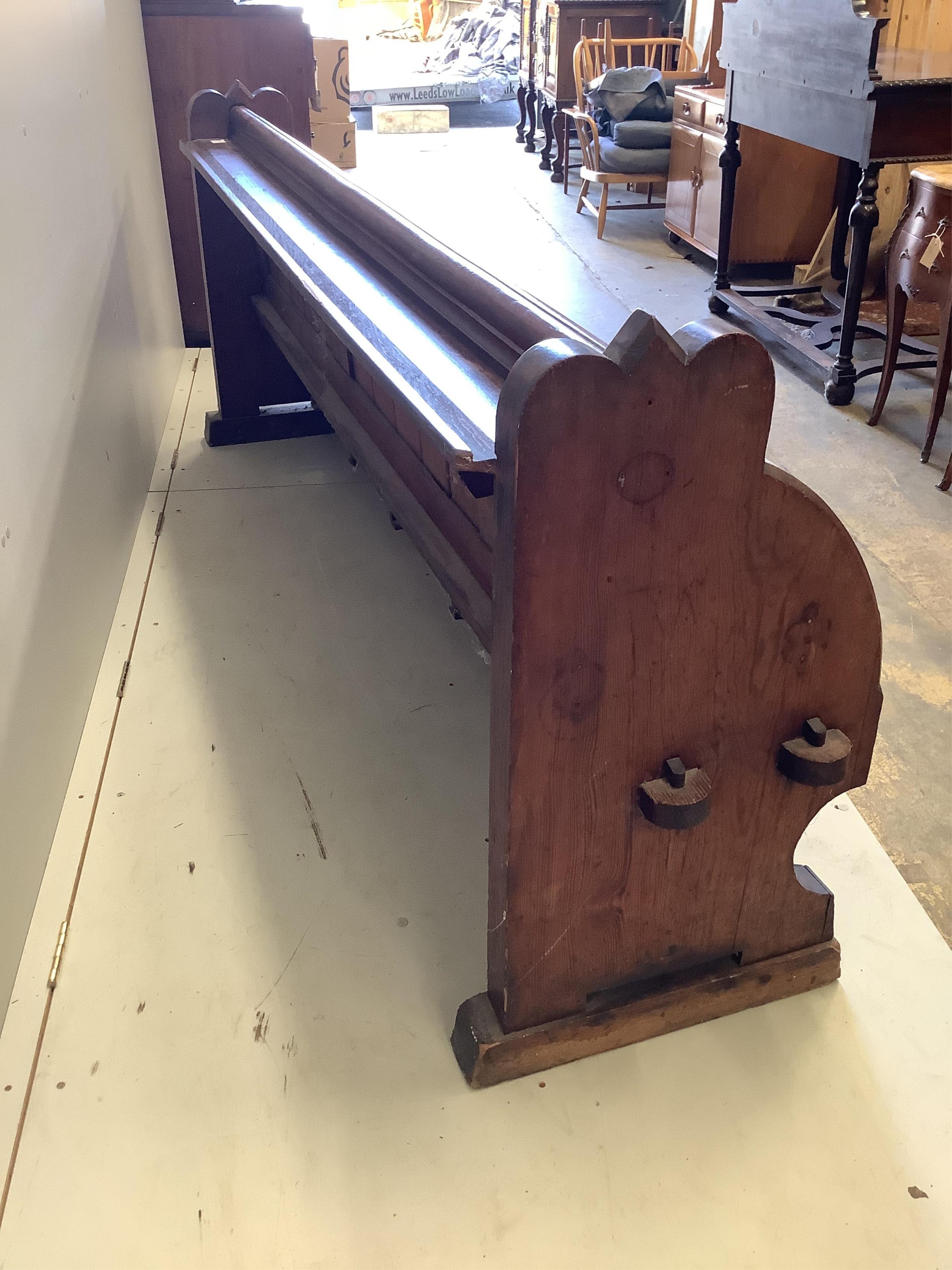 A Victorian pitch pine pew, width 223cm, depth 46cm, height 80cm. Condition - fair